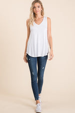 White V-neck high low sleeveless top. 