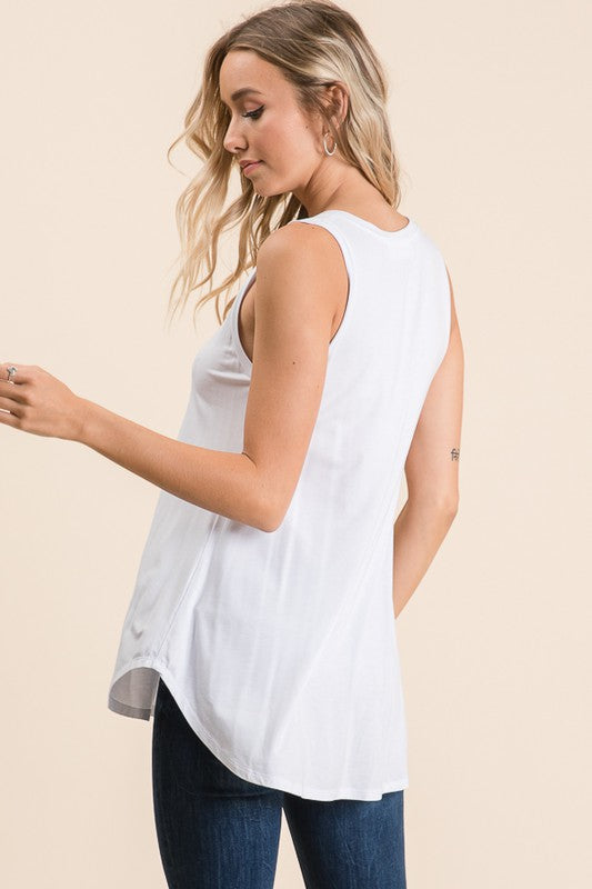 White V-neck high low sleeveless top. 