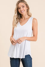 White V-neck high low sleeveless top. 