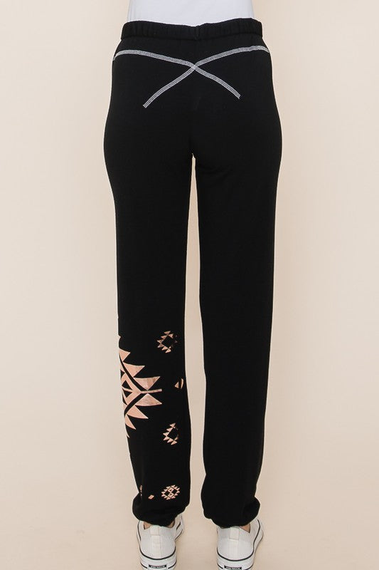 Jet Black French terry rollover joggers with rose gold tribal print