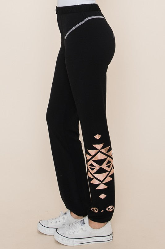 Jet Black French terry rollover joggers with rose gold tribal print