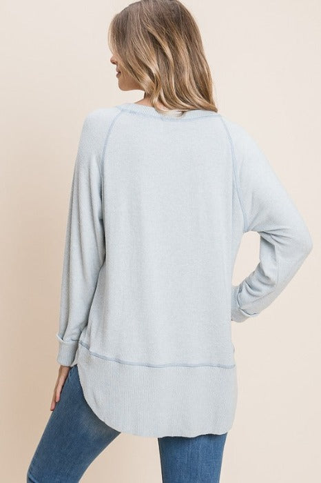 Sky Blue Tiger Brush boat neck top with cuffed sleeves and contrasting hem and stitch detail, relaxed fit tunic style.