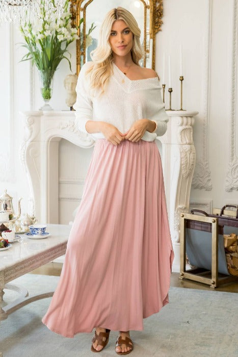 Solid Mauve soft jersey knit, high waisted maxi skirt with pockets and slit.